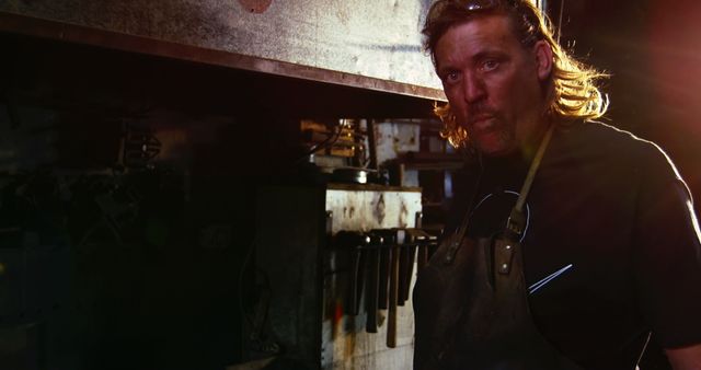 Male Blacksmith Portrait in Workshop with Rustic Ambience - Download Free Stock Images Pikwizard.com