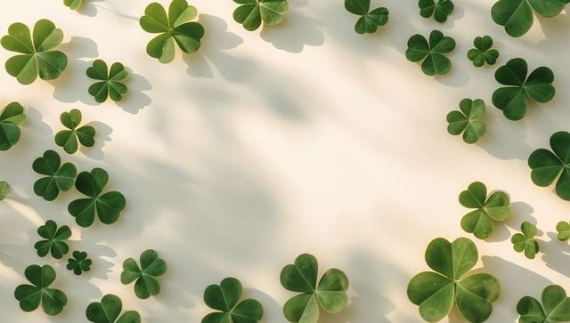 Framing clover leaf border on pale cream background with soft shadows, minimalist layouts