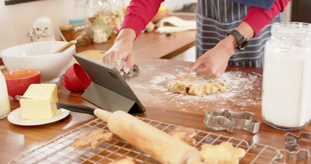 Person Baking Christmas Cookies with Tablet in Home Kitchen - Download Free Stock Images Pikwizard.com