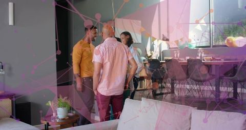 Friends chatting in modern loft during casual gathering with balloons and purple overlay