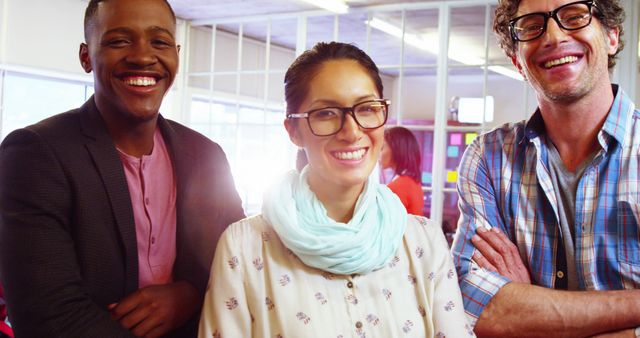 Diverse Colleagues Smiling in Modern Office Environment - Download Free Stock Images Pikwizard.com