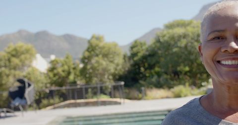 Joyful Senior Woman Outdoors in Nature with Bright Smile