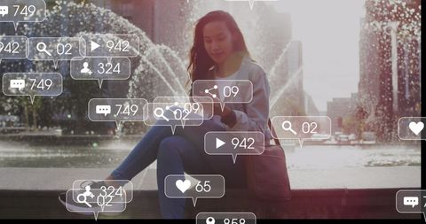 Woman Engaging with Social Media in Urban Fountain Backdrop