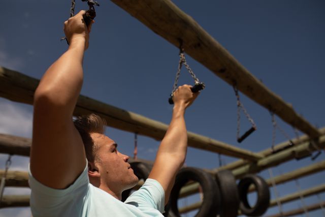 Caucasian Coach Hanging from Monkey Bars at Boot Camp - Download Free Stock Images Pikwizard.com