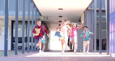 Joyful Students and Teacher Energically Running in School Corridor - Download Free Stock Images Pikwizard.com