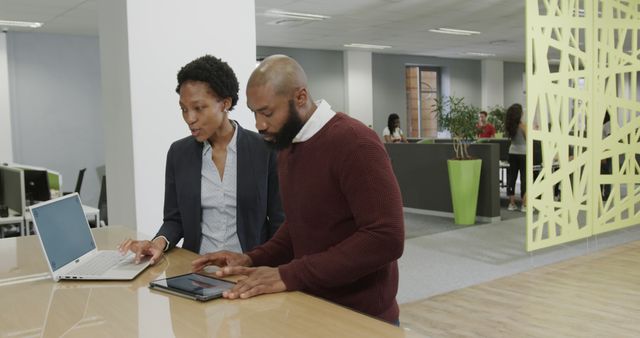 Colleagues Collaborating on Digital Devices in Modern Office - Download Free Stock Images Pikwizard.com