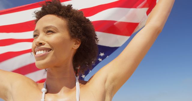 Joyful Woman Holding American Flag on Sunny Beach - Download Free Stock Images Pikwizard.com