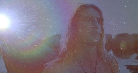 Man Embracing Peaceful Ocean Vibes at Sunset