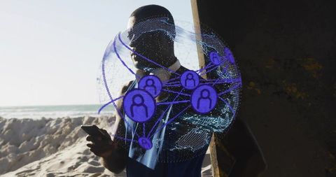 Man using smartphone at beach displaying holographic network globe overlay for connectivity