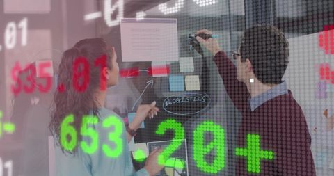Business team analyzing financial data in modern office setup