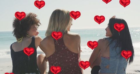 Female Friends Enjoying Day at Beach with Heart Icons