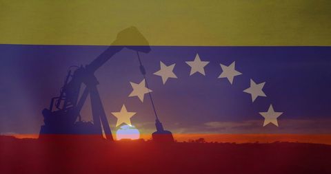 Oil Rig Silhouette Over Venezuelan Flag at Sunset
