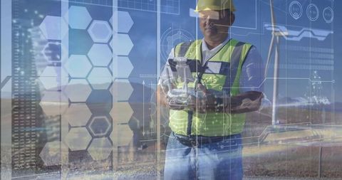 Technician Overseeing Wind Turbines Using Digital Interface