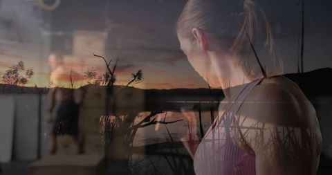 Female exerciser with dumbbell and lakeside sunset overlay