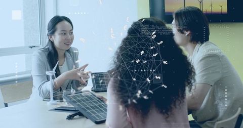 Innovative Team Discussing Sustainable Energy Solutions in Modern Office