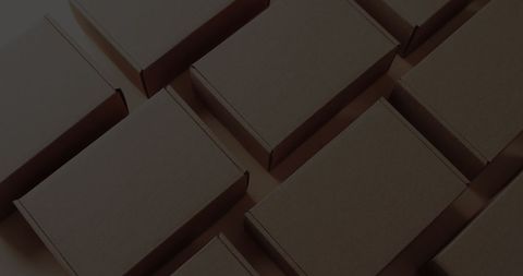 Neatly Arranged Brown Cardboard Boxes on Surface