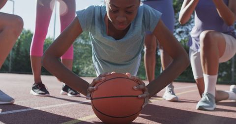 Diverse Female Basketball Player Practicing on Outdoor Court
