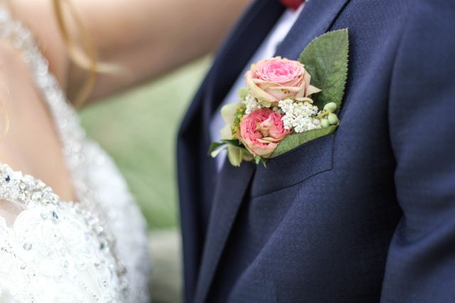 Close-up of Elegant Bridal Couple with Floral Boutonniere - Download Free Stock Photos Pikwizard.com