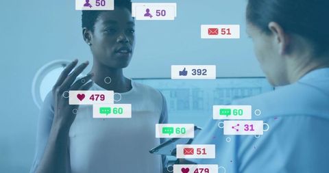 Businesswoman presenting social media analytics on tablet during team office briefing