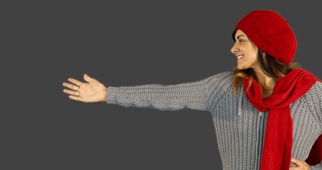 Smiling Woman in Cozy Winter Clothing Reaching Out - Download Free Stock Images Pikwizard.com