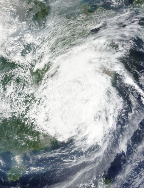 Captured by NASA's Terra satellite on August 9, 2015, this image shows the remnants of Typhoon Soudelor as it dissipates over eastern China. Ideal for use in weather-related articles, climate studies, or educational resources on natural disasters.