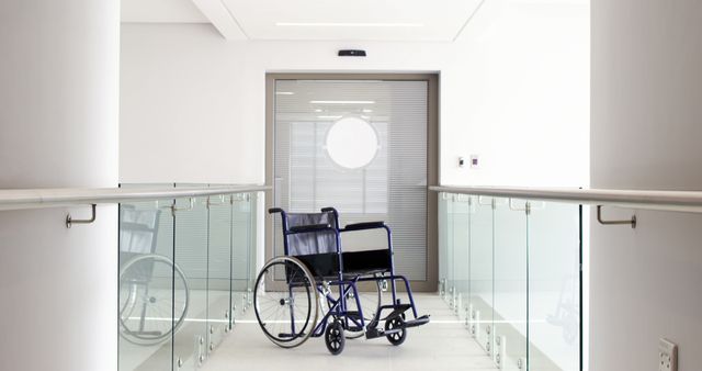 Empty Wheelchair in Bright Modern Hallway by Glass Railings - Download Free Stock Images Pikwizard.com