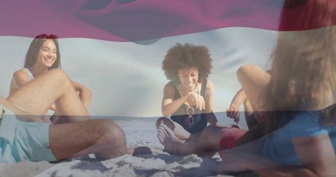 Friends relaxing on sunny beach with woman holding pink sunglasses and soft flag overlay