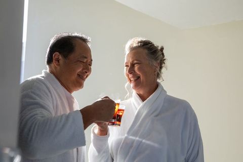 Senior couple connecting with steaming tea in relaxed setting