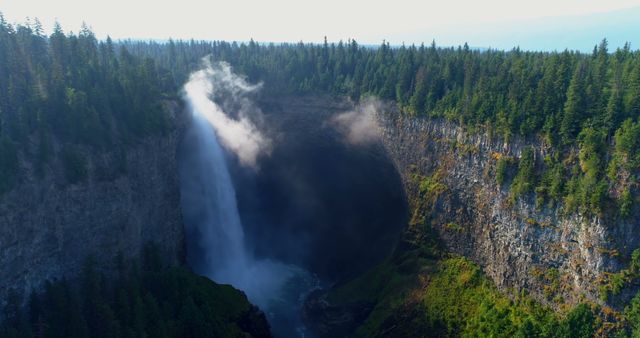 Majestic Waterfall in Lush Forested Canyon at Sunrise - Download Free Stock Images Pikwizard.com