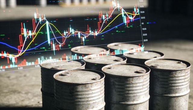 Rusted oil barrels sitting on concrete warehouse floor with candlestick stock chart overlay