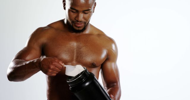 Athletic Man Preparing Protein Shake for Workout - Download Free Stock Images Pikwizard.com