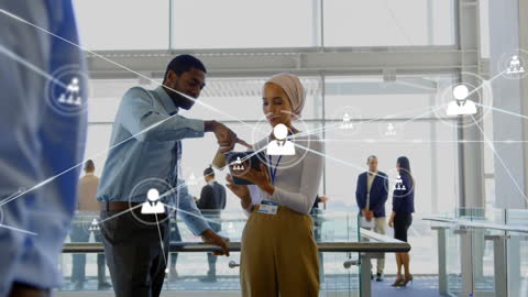 Multicultural Team Collaborating with Digital Technology in Office