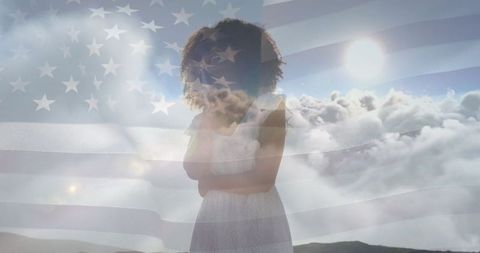 Patriotic spirit: woman in nature with american flag overlay