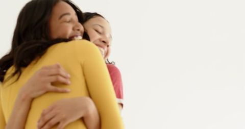 Joyful Friends Hugging in Close Bonding Moment