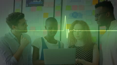 Diverse Business Team Analyzing Data on Laptop with Digital Heartbeat Overlay
