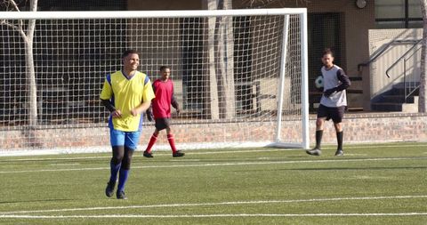 Youth Soccer Match with Athletes in Action on Sunny Day
