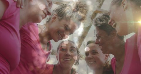 Diverse Group of Women Embracing Team Spirit