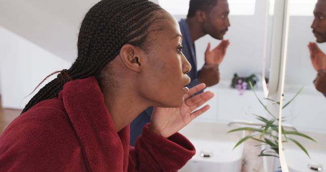 Man and Woman Practicing Skincare Routine in Bathroom Mirror - Download Free Stock Images Pikwizard.com