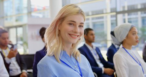 Confident Businesswoman Smiling at Seminar Event