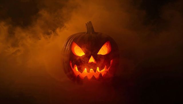 Spooky Glowing Jack-o'-Lantern with Ominous Smoke