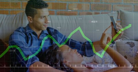 Couple Analyzing Growth Chart with Smartphone Insights