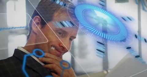 Businessman engaging with futuristic holographic display in office