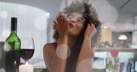 Woman Celebrating Valentine's Day with Wine and Virtual Call