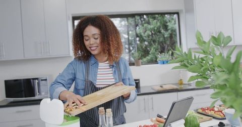 African American Woman Preparing Healthy Meal in Modern Kitchen