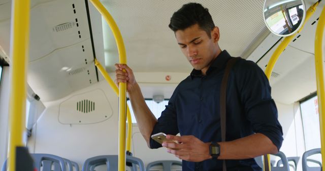 Young Man Standing on Public Bus Using Smartphone - Download Free Stock Images Pikwizard.com