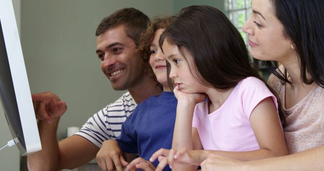 Family Using Computer Together at Home - Download Free Stock Images Pikwizard.com