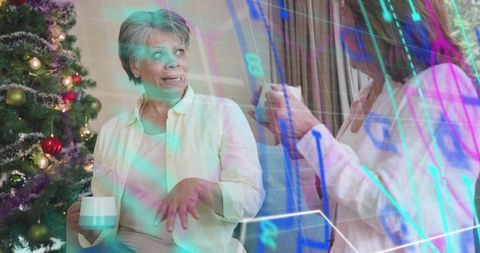 Senior woman chatting with family on sofa at christmas with financial chart overlay