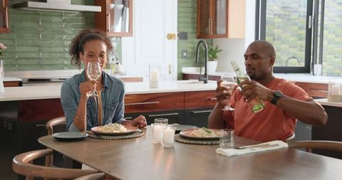 Couple Enjoying Cozy Home Dinner with Wine