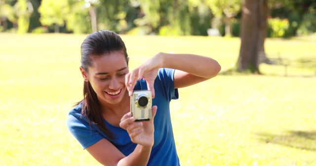 Young Woman Using Camera in Outdoor Park - Download Free Stock Images Pikwizard.com