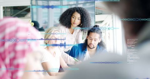 Collaborative Colleagues Analyzing Data in Modern Office